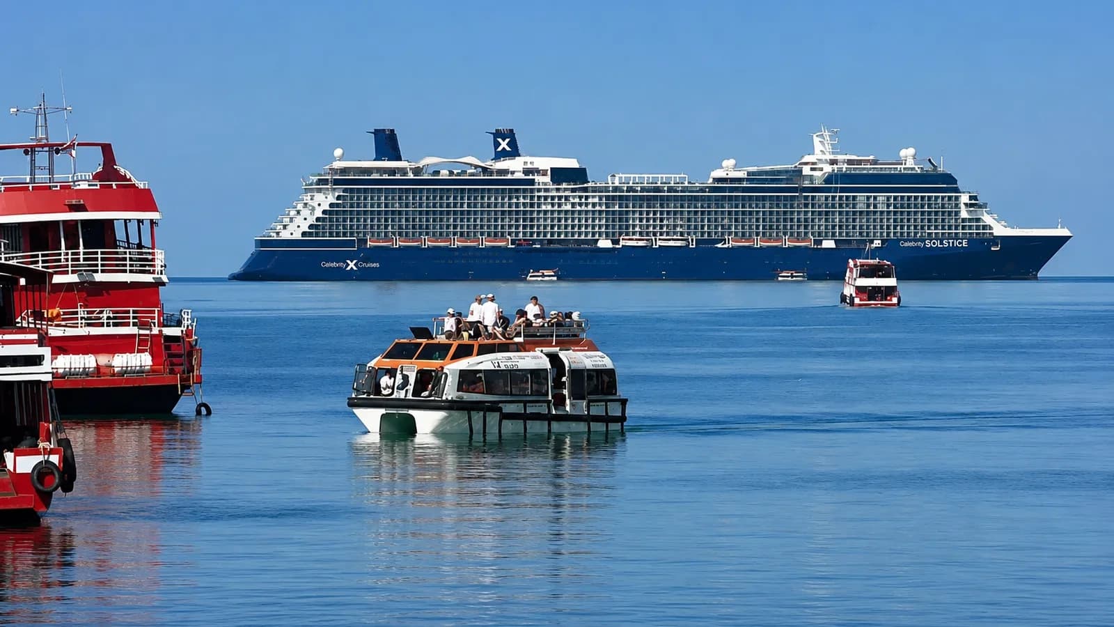 Cruise ship anchored off Nathon, Koh Samui, with a tender boat bringing passengers ashore