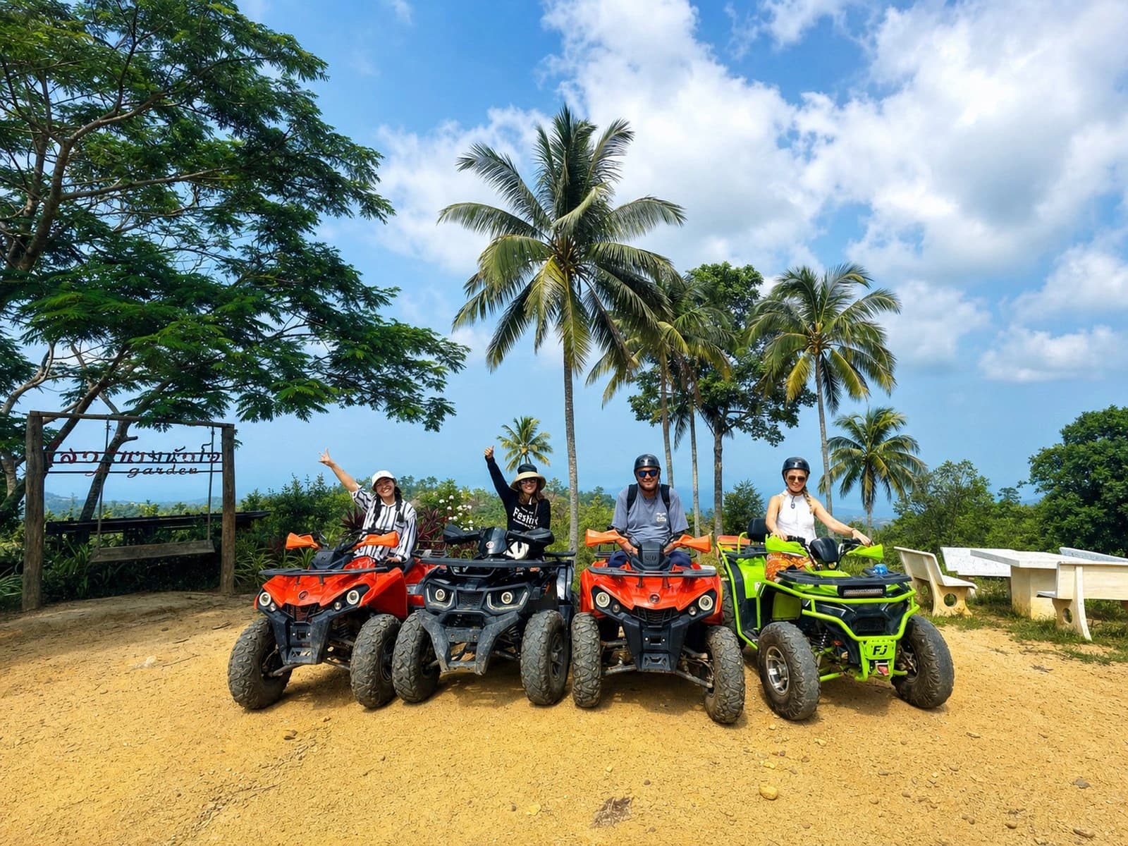 Green Mountain ATV tour group at tropical mountain viewpoint